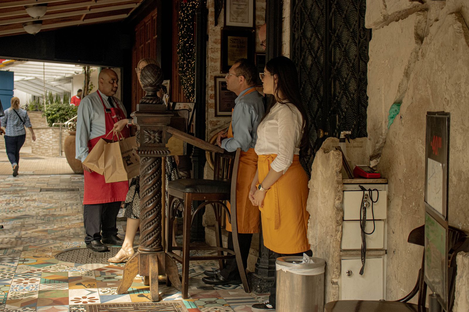 Restaurant staff warmly greeting a returning guest